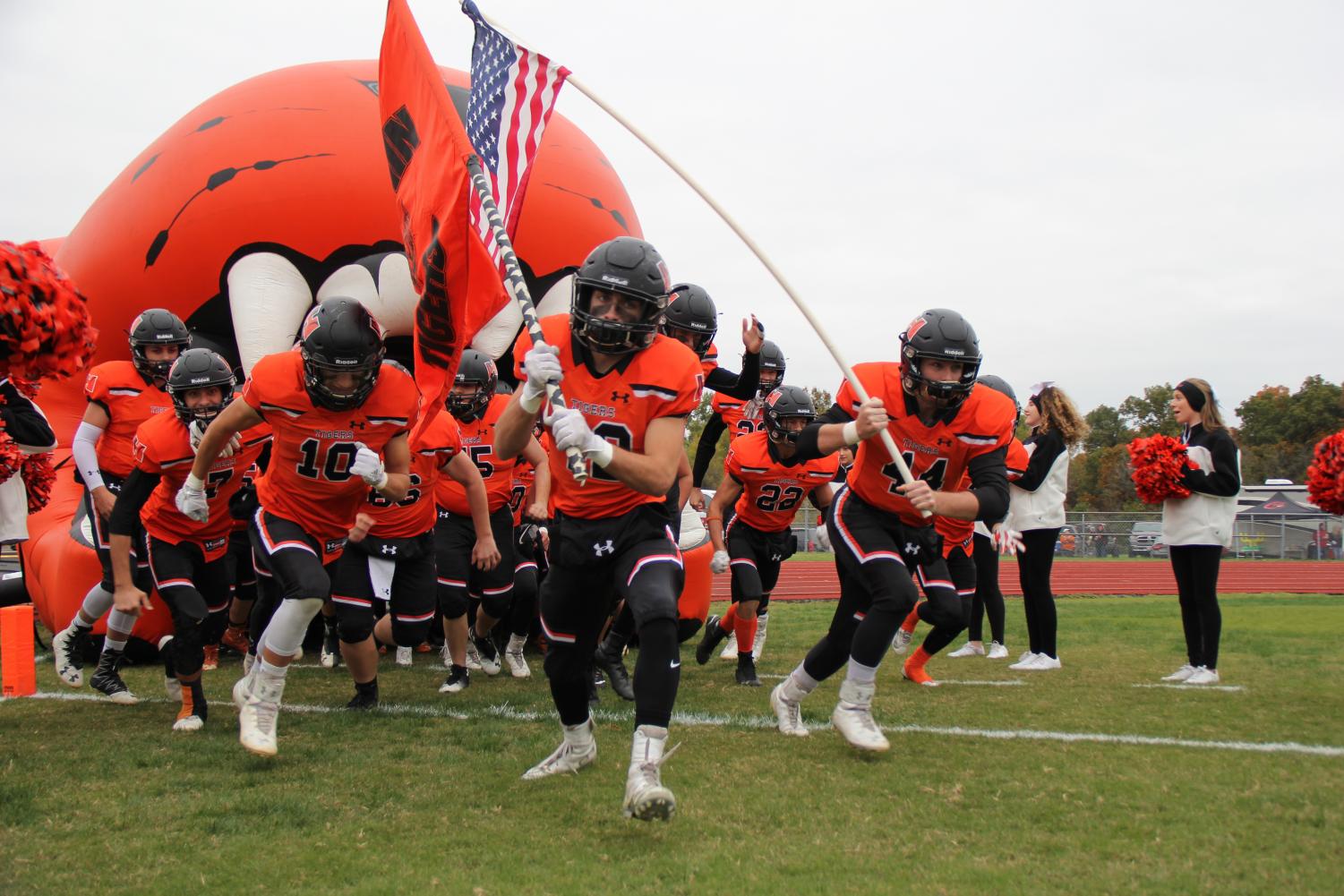 Seniors, Kyle Matuzak and Jase Gosha lead the team onto the field for round 1 of the playoffs.