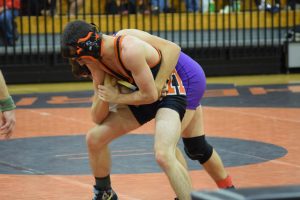 Senior Dylan Reagan fights to break the hold of his opponent. 