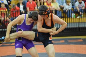 Senior Dylan Reagan braces against his opponents hold. 