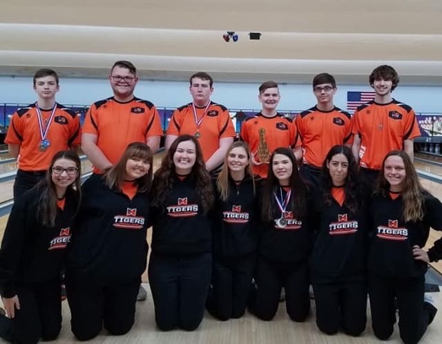 The+boys+and+girls+bowling+team+smile+at+their+successes.