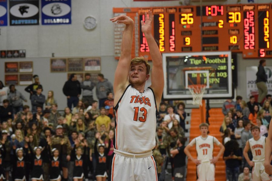 Garrett+Venegoni+focuses+on+making+the+basket.