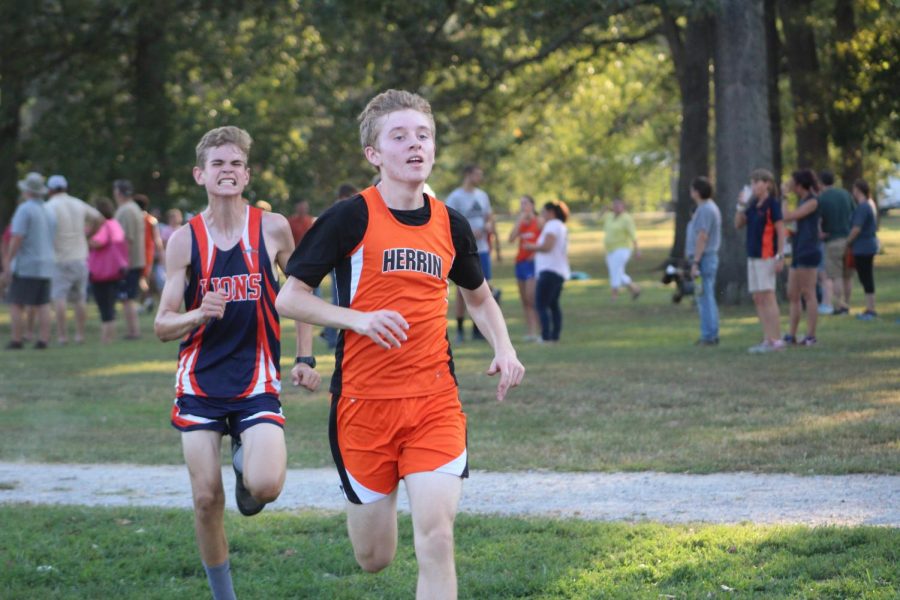 Riley Chrostoski (10) focuses on staying in front of a Carterville runner.