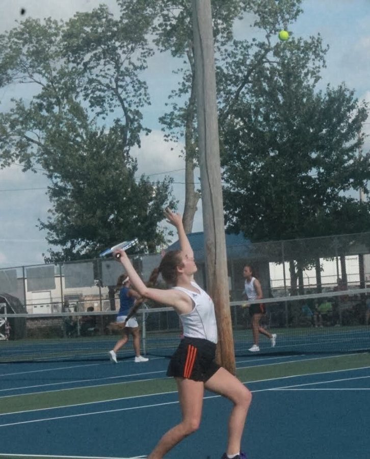 Karlie Hale, 11, focuses while getting ready to hit her serve in Flora on August 26.