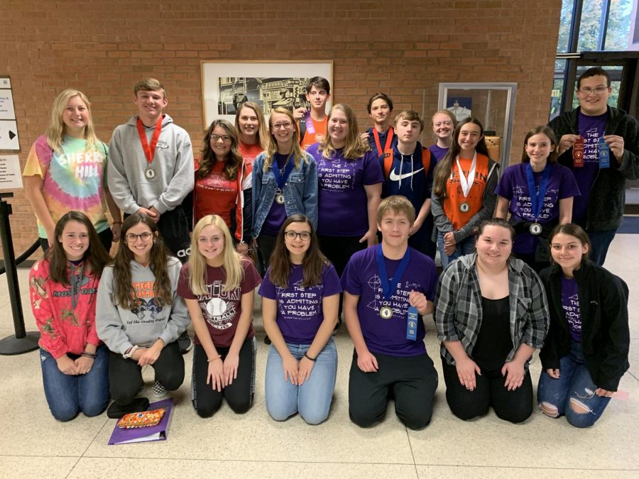 The Math Team proudly showcases their medals and ribbons after dominating round three of four of the SWIC series.  