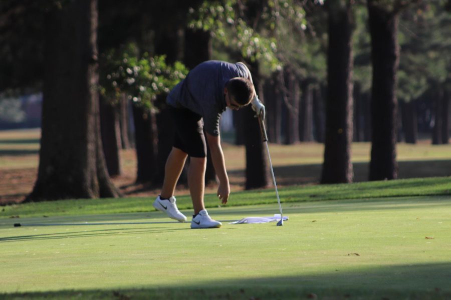 Josh Green (12) prepares to swing at the ball.