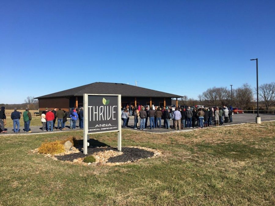 Hundreds of citizens line up outside Thrive, the new marijuana dispensary in Anna, as the new law was passed.