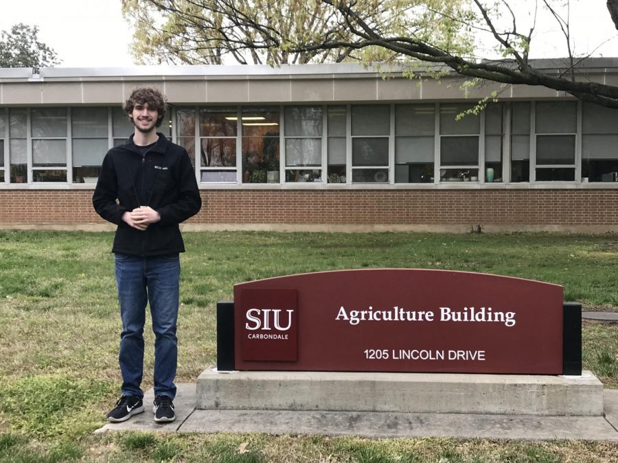 Zoller (12) smiling with pride at his college of choice.