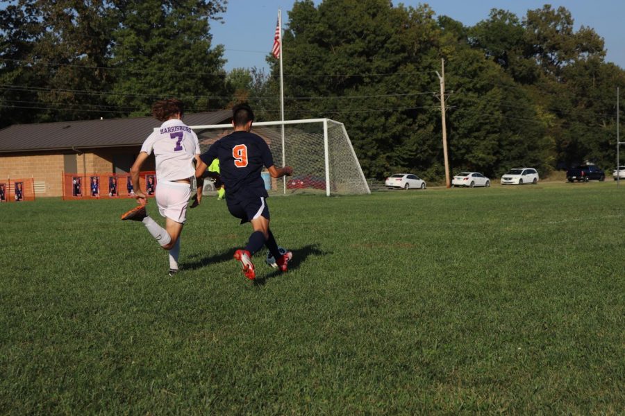 Jesus Mendez (12) dribbles the ball toward the goal.