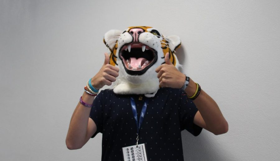 Jarret Coleman tries on the tiger head.