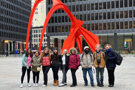 The attendees of the Chicago trip smile for a photo with The attendees of the Chicago trip smile for a photo with Calder’s Flamingo..