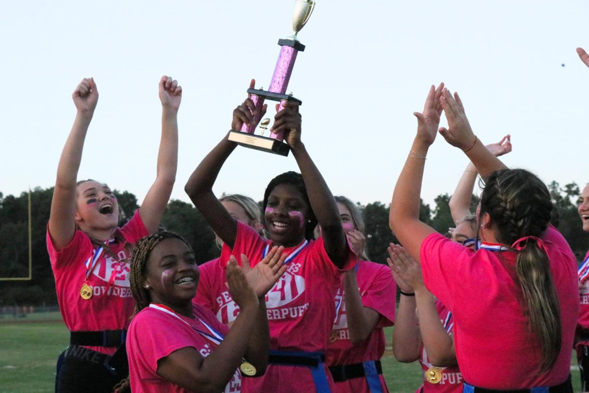 The senior team cheers as they collect the Powderpuff trophy for the second year in a row.