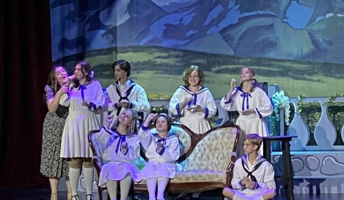The VonTrapp children, played by Jaci Bethel (12), Carver Hall (9), Sydney Atchinson (11), Frankie Patalano (9), Imogen Coop (9), Mads LaBotte (12) and Sarah Johnson (10), sing Do-Re-Mi with Maria, portrayed by Kat Weaver (12).