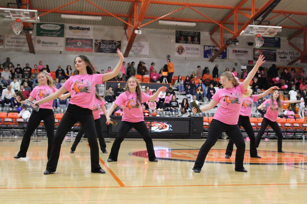 The dance team performs with their pictures commemorating their loved ones who are fighting or have fought cancer.