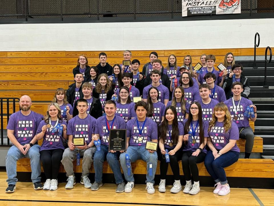 The HHS Mathletes proudly pose with all their awards they earned from Regionals on February 24th.