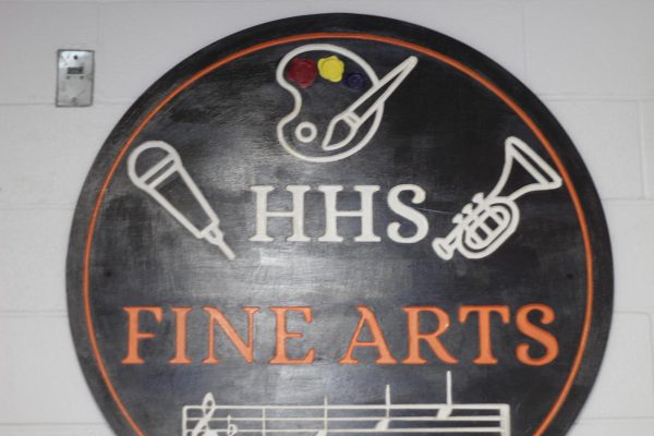 This sign created by the HHS art department symbolizes the different aspects of the fine arts department at HHS.
