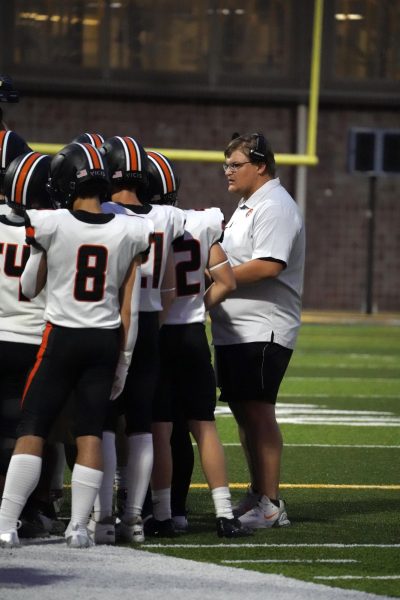 Coach Shockley is in action, coaching his team at the first football game against Marion.