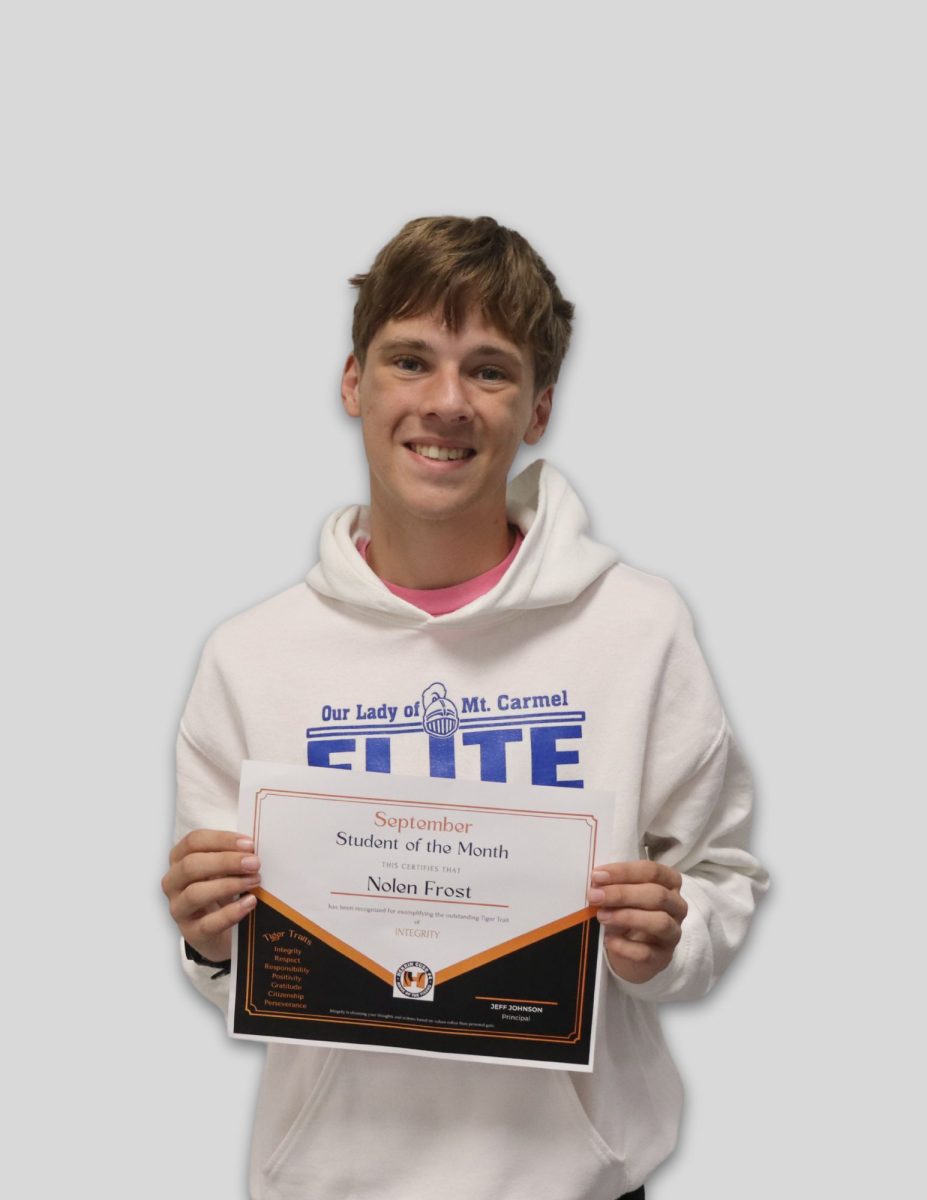 Nolen Frost (10) eagerly shows off his award