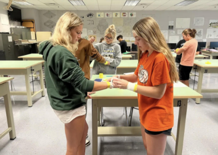  Saylor Ray (12) practices sports medicine techniques in preparation for a future health occupation.
