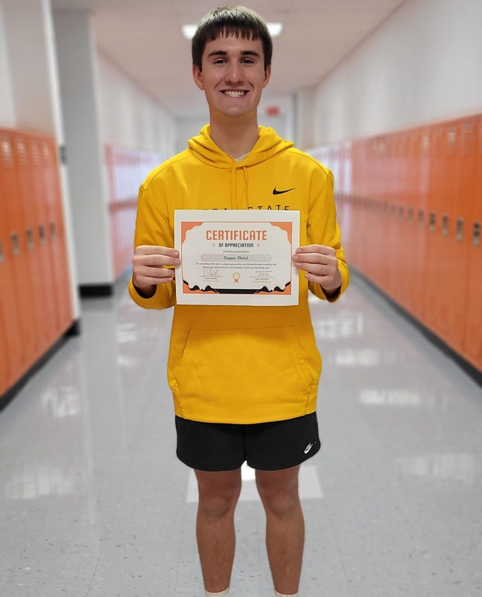Cooper Christ (12) is presented with his certificate.
