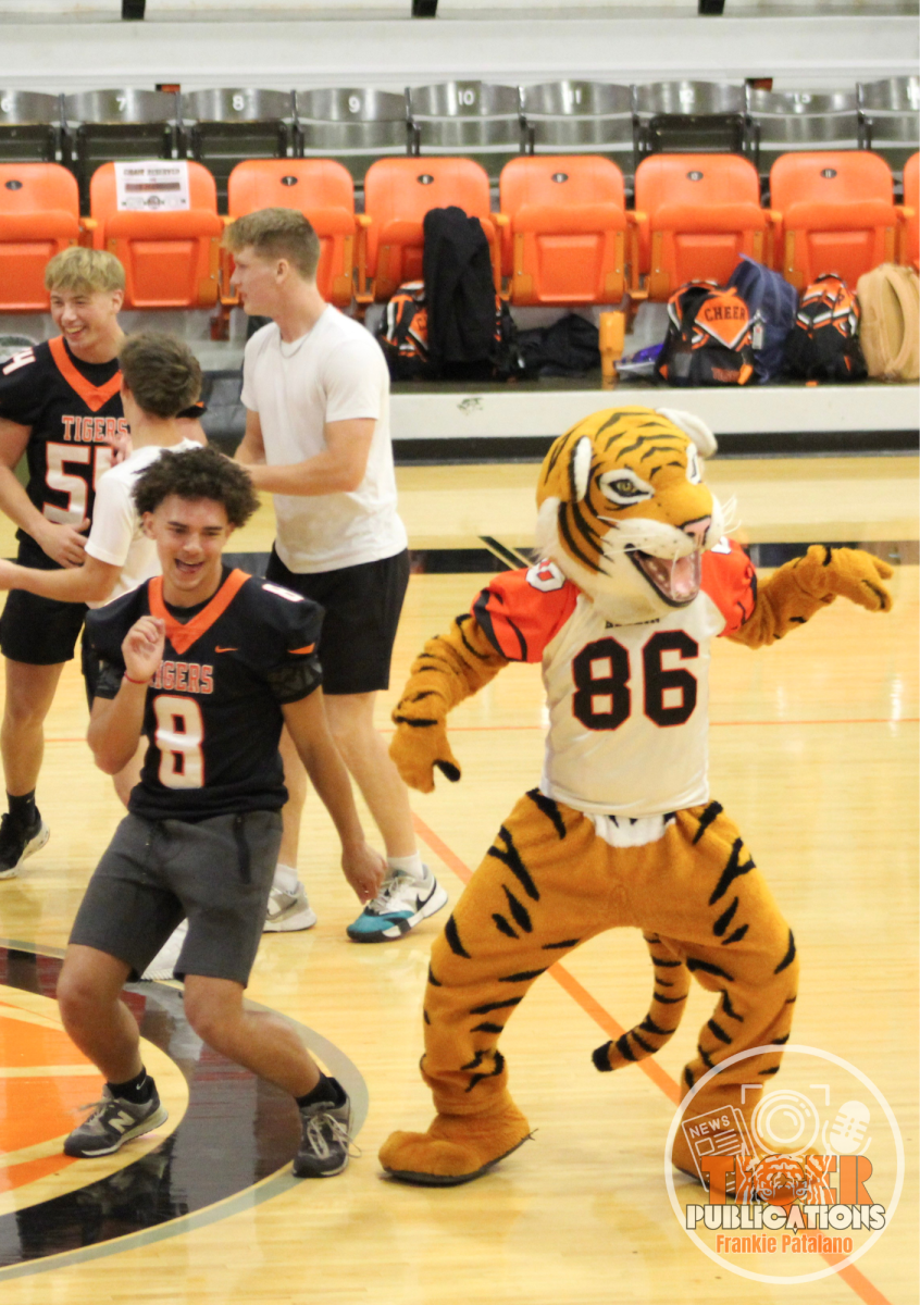 The football boys compete in a dance-off against our Herrin Tiger mascot. 