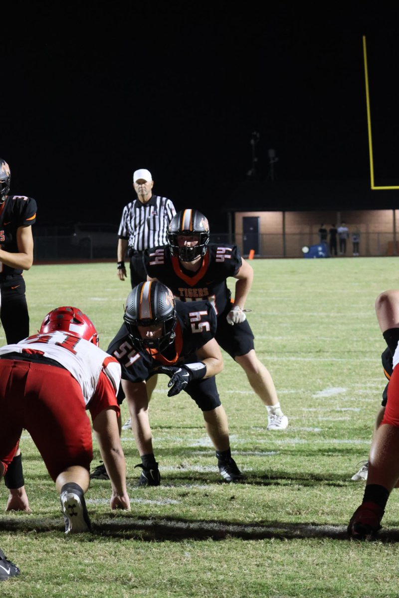 Seniors Scotty Reynolds and Dennis Hughes line up to run a play

