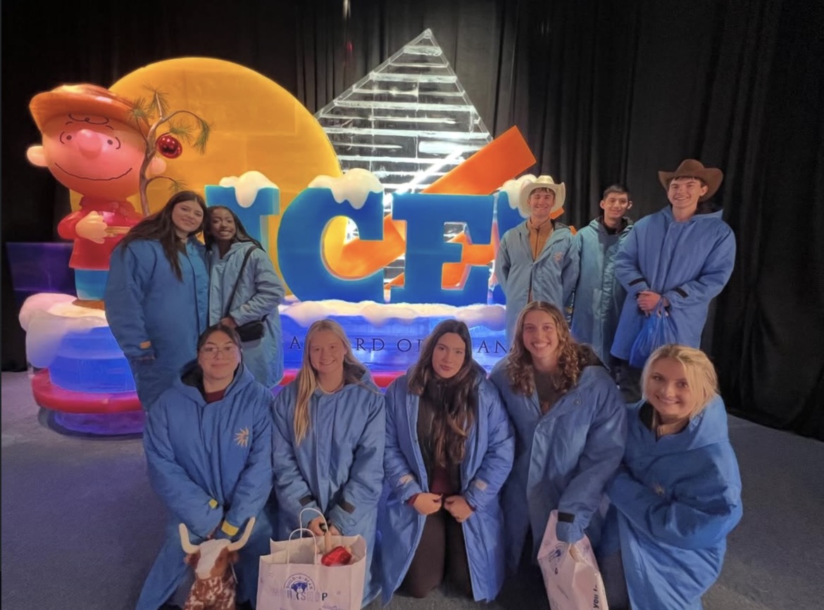 The journalists bundle up and enjoy a beautiful Charlie Brown Christmas Ice Sculpture