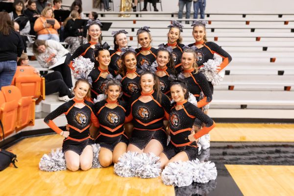 The cheerleaders pose during one of the home basketball games.