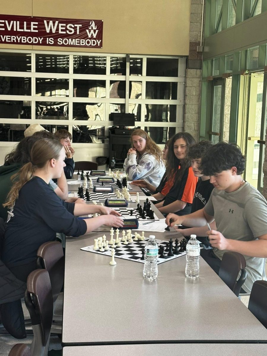 Some of the members of the chess team are pictured playing in the tournament on January 10